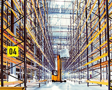 Forklift truck lifts goods into the high shelves of the SternMaid warehouse